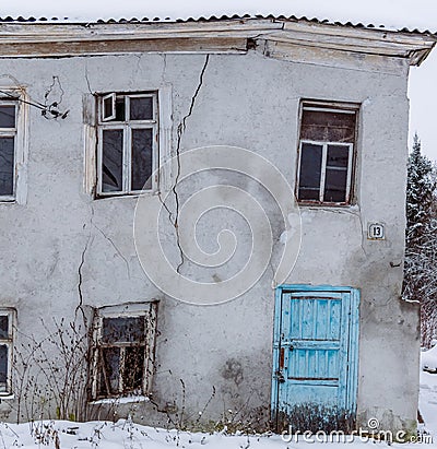 Old damaged house with wall cracks Editorial Stock Photo
