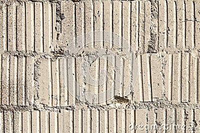 Old damaged masonry grooved concrete blocks, abstract texture for background. Stock Photo