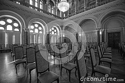 Old decorative interior of architectural monument Chandelier and chairs Editorial Stock Photo