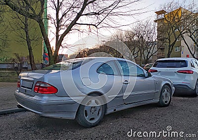 Silver grey old classic vintage veteran rusty coupe car Mercedes Benz CLK parked Editorial Stock Photo