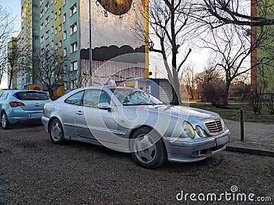 Silver grey old classic vintage veteran rusty coupe car Mercedes Benz CLK parked Editorial Stock Photo