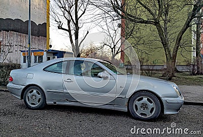 Silver grey old classic vintage veteran rusty coupe car Mercedes Benz CLK parked Editorial Stock Photo