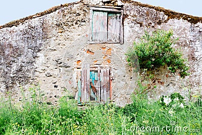 Old deserted house with wooden door Stock Photo