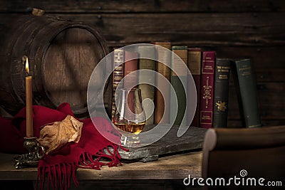 Old Desk with Whisky and Classic Books Stock Photo