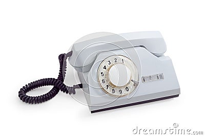 Old telephone set with rotary dial in white plastic housing Stock Photo