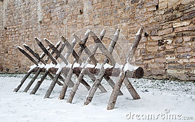 The old device for sawing wood in the fortress Izborsk winter Editorial Stock Photo