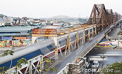 Old diesel engine train running on Long Bien bridge Editorial Stock Photo