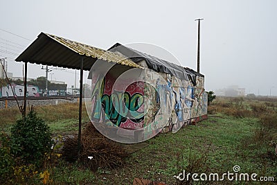 old and dilapidated house of the guard railway lines with the word hope painted on the wall. Stock Photo