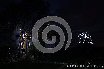 Old dilapidated hut at darkness Stock Photo