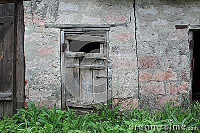 brick wall with old dilapidated wooden door Stock Photo