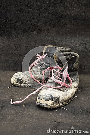 Old dirty black leather shoes. Stock Photo