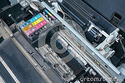 Old, dirty, disassembled ink jet printer. View of internal parts. Stock Photo