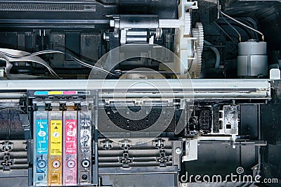 Old, dirty, disassembled ink jet printer. View of internal parts. Stock Photo