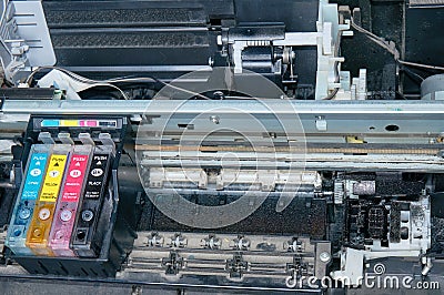 Old, dirty, disassembled ink jet printer. View of internal parts. Stock Photo