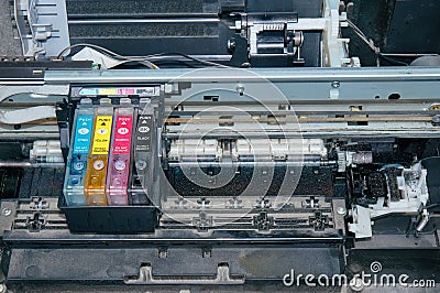 Old, dirty, disassembled ink jet printer. View of internal parts. Stock Photo