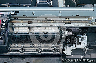 Old, dirty, disassembled ink jet printer. View of internal parts. Stock Photo