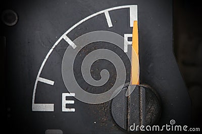 Old and dirty fuel gauge. Stock Photo