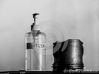 Old dirty piston and hand sanitizer Stock Photo