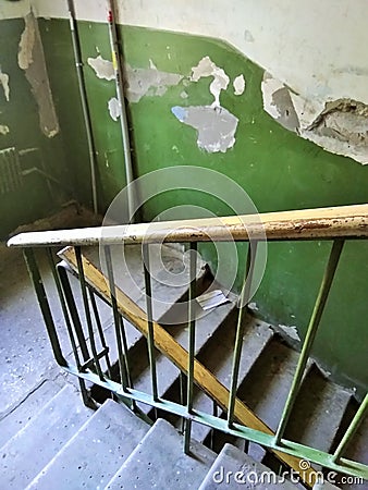 Old dirty shabby entrance with stairs Stock Photo