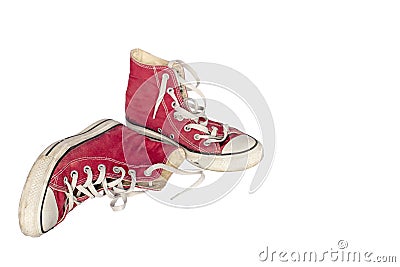 Old dirty shabby red sneakers close-up Stock Photo