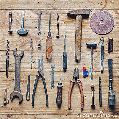 Old dirty vintage repair tools on wooden background Stock Photo