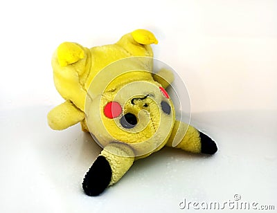 Old dirty wet toy. Washing an old plush toy. Poor Pikachu Editorial Stock Photo