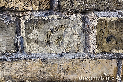 Old dirty yellow brick wall closeup texture Stock Photo
