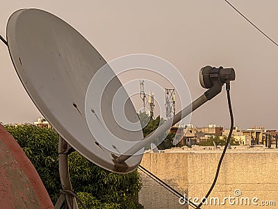 An old dish antina on the roof Stock Photo