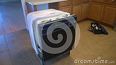 Old dishwasher take out Stock Photo