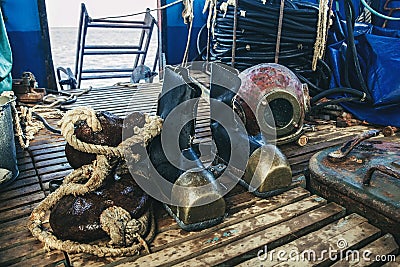 Old diving equipment on board Stock Photo