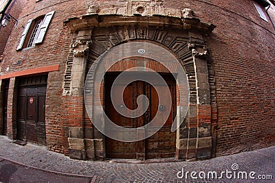 Old Door in a Brick Building Stock Photo