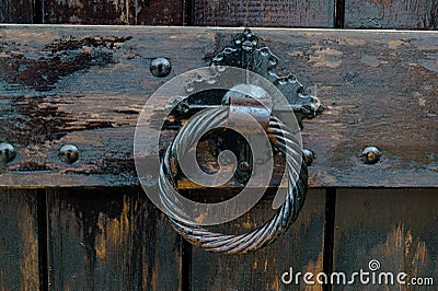 Old door handle, detail of an ancient decorated handle, vintage Stock Photo