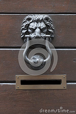 Old door knocker lion and mailbox Stock Photo