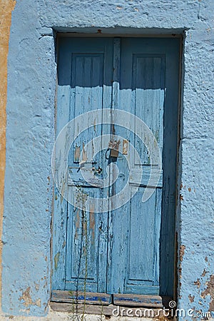 Old door of ruined home in Kefalos Stock Photo