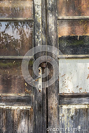 Old mystical door from a worker`s bungalow. Stock Photo