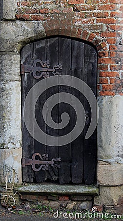 Old doorway detail, decorative hinges Stock Photo