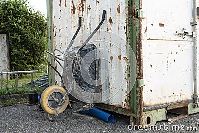 old durty construction wheelbarrow Stock Photo
