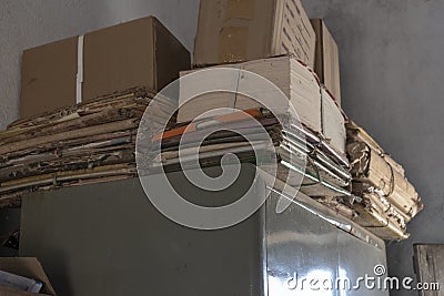 Old dusty stack of papers, files, documents on the shelves of the archive room Stock Photo