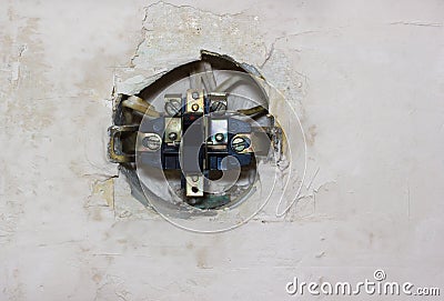 Old electric switch in the wall Stock Photo