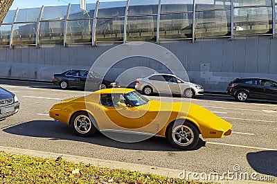 Classic old yellow veteran vintage historic muscle sports Chevrolet Corvette car driving Editorial Stock Photo