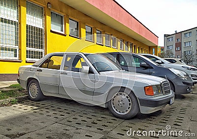 White veteran vintage classic old white sedan car Mercedes Benz 190E parked Editorial Stock Photo