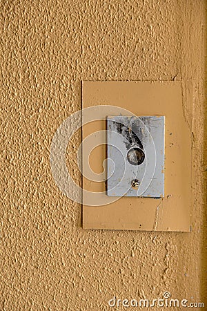 Old elevator call button with grungy pattern in a soviet building in post-soviet Riga, Latvia Stock Photo