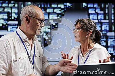 Old employees working in data center Stock Photo