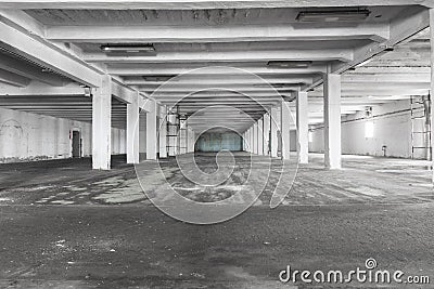 Old empty industrial warehouse interior, bright light Stock Photo