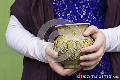 An Old Empty Weathered Vase Holden by Hands Stock Photo