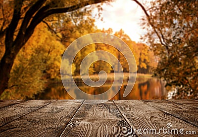 Old empty wooden table over the lake Stock Photo