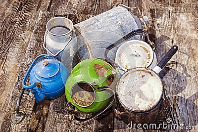 Old enamelled or aluminum cookware Stock Photo