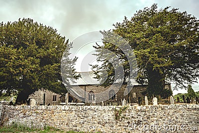 Old English churchyard and giant tree Landscape Stock Photo