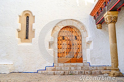 Old entrance door of an ancient building with a graceful pattern Stock Photo