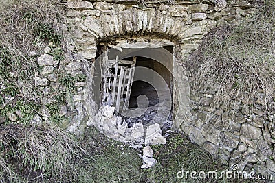 Old entrance to a cave Stock Photo